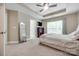Spacious main bedroom with neutral carpeting, and natural light from large window at 244 River Clay Rd, Fort Mill, SC 29708
