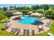 Aerial view of the community swimming pool surrounded by lounge chairs and tables at 244 River Clay Rd, Fort Mill, SC 29708