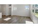 Bright living room with large windows and hardwood floors, providing ample natural light at 2708 Lehigh Rd, Charlotte, NC 28208