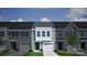 Charming townhome featuring light green siding, a one car garage, and a neatly trimmed front lawn at 2720 Lehigh Rd, Charlotte, NC 28208