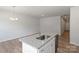 Kitchen featuring large island with granite countertops, stainless steel sink and appliances at 2720 Lehigh Rd, Charlotte, NC 28208