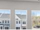 Modern home interior featuring light-filled rooms with large windows, showcasing the exterior view at 2720 Lehigh Rd, Charlotte, NC 28208