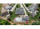 Aerial view of home featuring large inground pool, outdoor seating area, patio, well-manicured landscaping and mature trees at 2763 Rivendale Ct, Indian Land, SC 29707