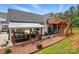 The backyard showcases an outdoor bar and kitchen area, with an exterior staircase at 2763 Rivendale Ct, Indian Land, SC 29707