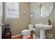 Neat half-bathroom with neutral paint, decor, and pedestal sink at 2763 Rivendale Ct, Indian Land, SC 29707