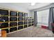 Versatile bedroom space with shelving and a window for natural light at 2763 Rivendale Ct, Indian Land, SC 29707