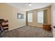 Cozy bedroom features neutral walls, two windows, and carpeted floors at 2763 Rivendale Ct, Indian Land, SC 29707