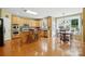 Bright kitchen featuring hardwood floors, ample cabinet space, stainless steel appliances, and an island with seating at 2763 Rivendale Ct, Indian Land, SC 29707