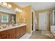 Main bathroom featuring double sinks, vanity, lots of counter space, and walk-in shower at 2763 Rivendale Ct, Indian Land, SC 29707