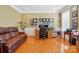 Comfortable office features a plush couch, hardwood flooring, and natural light at 2763 Rivendale Ct, Indian Land, SC 29707
