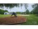 Well maintained playground and basketball court surrounded by lush green space at 2763 Rivendale Ct, Indian Land, SC 29707