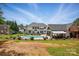 Expansive backyard features a pool, patio area, and outdoor living spaces at 2763 Rivendale Ct, Indian Land, SC 29707
