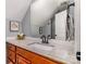 Bathroom featuring a granite countertop, wood cabinets, a large mirror, and brushed black plumbing at 2845 Lakefront Dr, Belmont, NC 28012