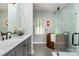 A stylish bathroom featuring a stand-alone copper tub, glass shower, and a marble vanity at 2845 Lakefront Dr, Belmont, NC 28012