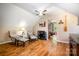 Cozy bedroom featuring hardwood floors, soft natural light, and a glimpse into an adjoining room, creating a relaxing atmosphere at 2845 Lakefront Dr, Belmont, NC 28012