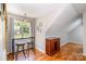 Cozy breakfast nook featuring bar-height seating, natural light, and hardwood flooring throughout at 2845 Lakefront Dr, Belmont, NC 28012