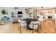 Open-concept living space with dining area, stairs to upper floor, and views to the living room and kitchen at 2845 Lakefront Dr, Belmont, NC 28012