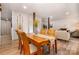 Charming dining area featuring a wooden table with seating for four, accented by decorative oars and white shiplap walls at 2845 Lakefront Dr, Belmont, NC 28012