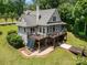 Stunning aerial view of home with expansive deck, garden, and walk-out basement to a well-manicured lawn at 2845 Lakefront Dr, Belmont, NC 28012