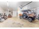 Well-lit garage with recreational vehicle, mower, and ample workspace at 2845 Lakefront Dr, Belmont, NC 28012