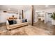 Cozy living room showcasing neutral tones, shiplap walls, stylish furniture, and wood flooring, creating a welcoming space at 2845 Lakefront Dr, Belmont, NC 28012