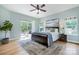 Comfortable main bedroom with hardwood floors, a sliding glass door to the deck, and ample natural light at 2845 Lakefront Dr, Belmont, NC 28012