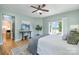 Spacious main bedroom featuring hardwood floors, ceiling fan, and a sliding glass door leading to the outdoor deck at 2845 Lakefront Dr, Belmont, NC 28012