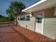 Cozy back deck, perfect for outdoor entertaining and relaxation, with a white door at 300 W 12Th St, Salisbury, NC 28144