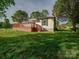 Expansive backyard featuring lush green lawn and mature trees, ideal for outdoor enjoyment at 300 W 12Th St, Salisbury, NC 28144