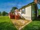 A cozy backyard featuring a deck and brick walkway for outdoor relaxation and enjoyment at 300 W 12Th St, Salisbury, NC 28144