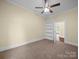 Cozy bedroom with neutral carpet and view to a connecting room at 300 W 12Th St, Salisbury, NC 28144