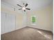 Cozy bedroom featuring carpet floors, ceiling fan and ample natural light at 300 W 12Th St, Salisbury, NC 28144