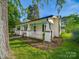 Side view of charming home with a well-manicured lawn and inviting front porch at 300 W 12Th St, Salisbury, NC 28144