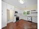 Modern kitchen featuring stainless steel appliances, white cabinetry, and hardwood floors at 300 W 12Th St, Salisbury, NC 28144