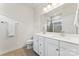 Bathroom featuring double sinks, white cabinets, tile flooring, and a large mirror at 3003 Salix Bend Dr, Charlotte, NC 28205