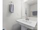 Bathroom featuring a modern floating sink, large mirror, and stylish towel rack at 3003 Salix Bend Dr, Charlotte, NC 28205