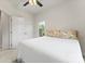 Bedroom boasts a plush bed, ceiling fan, and a sunny window offering natural light at 3003 Salix Bend Dr, Charlotte, NC 28205