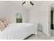 Bedroom featuring a plush bed, ceiling fan, and a sunny window offering natural light at 3003 Salix Bend Dr, Charlotte, NC 28205