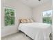 Bright bedroom with two large windows and a plush bed for a cozy retreat at 3003 Salix Bend Dr, Charlotte, NC 28205
