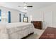 Bedroom featuring neutral walls, a ceiling fan, a dresser, and an open entranceway at 3003 Salix Bend Dr, Charlotte, NC 28205