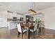 The dining room shows a large dining table and the kitchen and living room are in the background at 3003 Salix Bend Dr, Charlotte, NC 28205