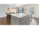 Kitchen island featuring pendant lighting, modern faucet, and white countertop at 3003 Salix Bend Dr, Charlotte, NC 28205
