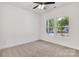 Bright bedroom with a ceiling fan and two windows offering ample natural light at 321 Whitner St, Rock Hill, SC 29732