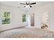 Bedroom features carpet, a ceiling fan, and an attached bathroom at 321 Whitner St, Rock Hill, SC 29732