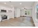 Well-lit open living space with hard surface floors, ceiling fan, and modern finishes at 321 Whitner St, Rock Hill, SC 29732