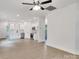 Open floor plan featuring a kitchen with white cabinets and stainless steel appliances at 321 Whitner St, Rock Hill, SC 29732