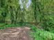 Picturesque backyard highlighting a peaceful setting, with lush plants and a charming picket fence at 4951 Dayspring Dr, Mint Hill, NC 28227