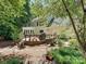 Backyard view with spacious deck perfect for entertaining, and lush, landscaped surroundings at 4951 Dayspring Dr, Mint Hill, NC 28227