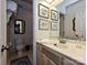 Well-lit bathroom with framed art, decorative mirror, and a vanity with ample counter space at 4951 Dayspring Dr, Mint Hill, NC 28227