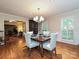 Bright dining room with hardwood floors, wainscoting, and open access to living areas at 4951 Dayspring Dr, Mint Hill, NC 28227